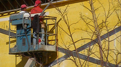 Construction workers in aerial lift