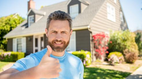 Satisfied home improvement customer giving thumbs up